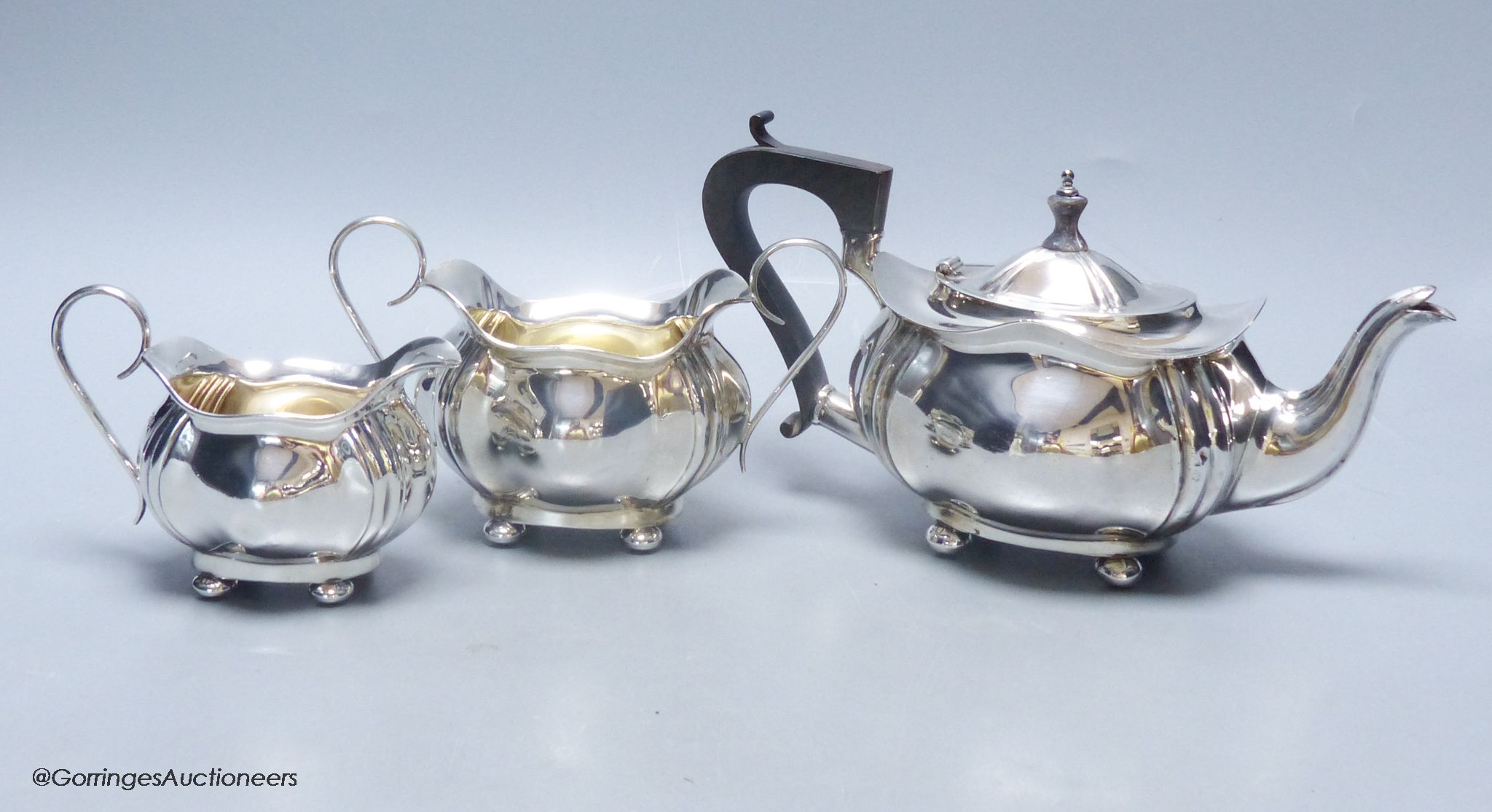 A Scottish silver three-piece tea service, of ribbed, bellied oval form, gross 18.5oz approximately